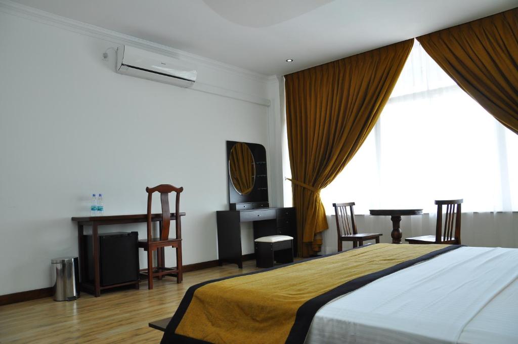 Postel nebo postele na pokoji v ubytování Hotel East Lagoon