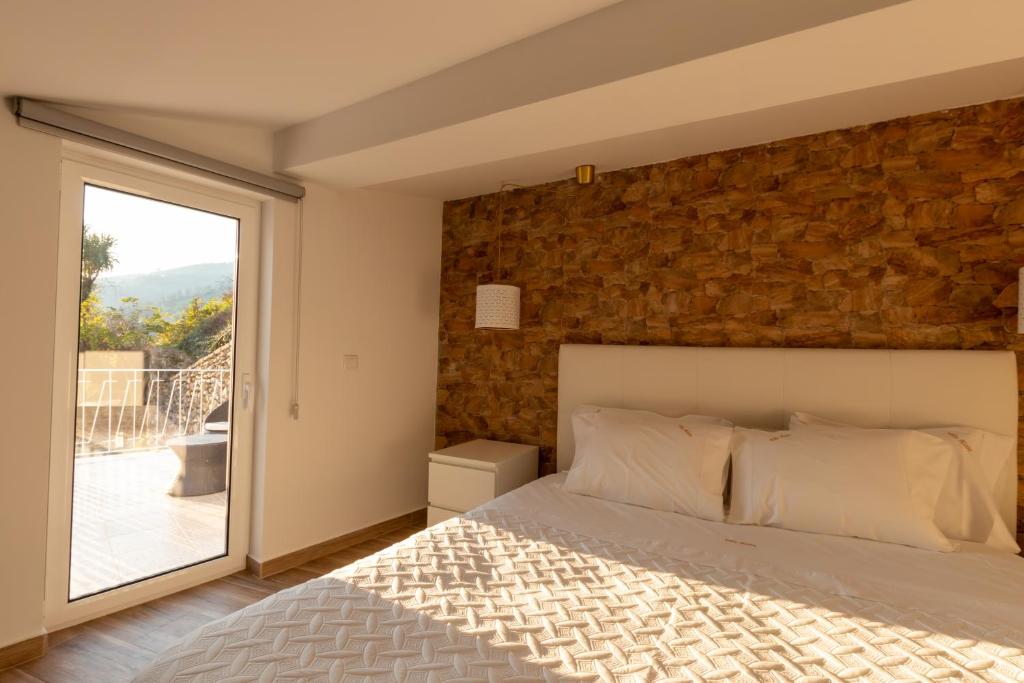 Uma cama ou camas num quarto em Villa Alzira