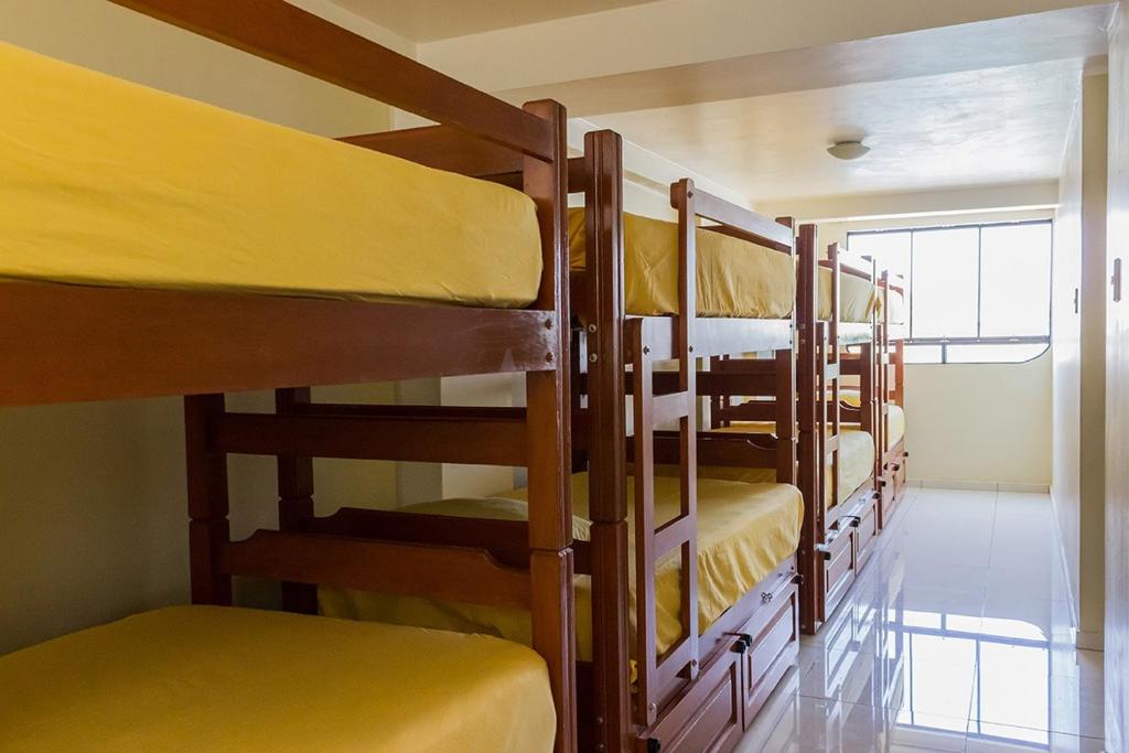 a group of bunk beds in a room at ica wasi hostel in Ica