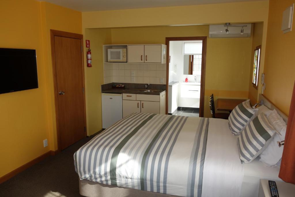 Postel nebo postele na pokoji v ubytování Beachside Villas Motel