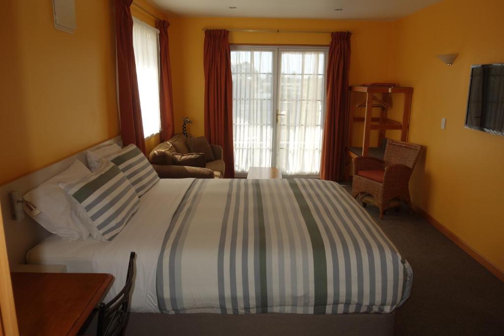 Postel nebo postele na pokoji v ubytování Beachside Villas Motel