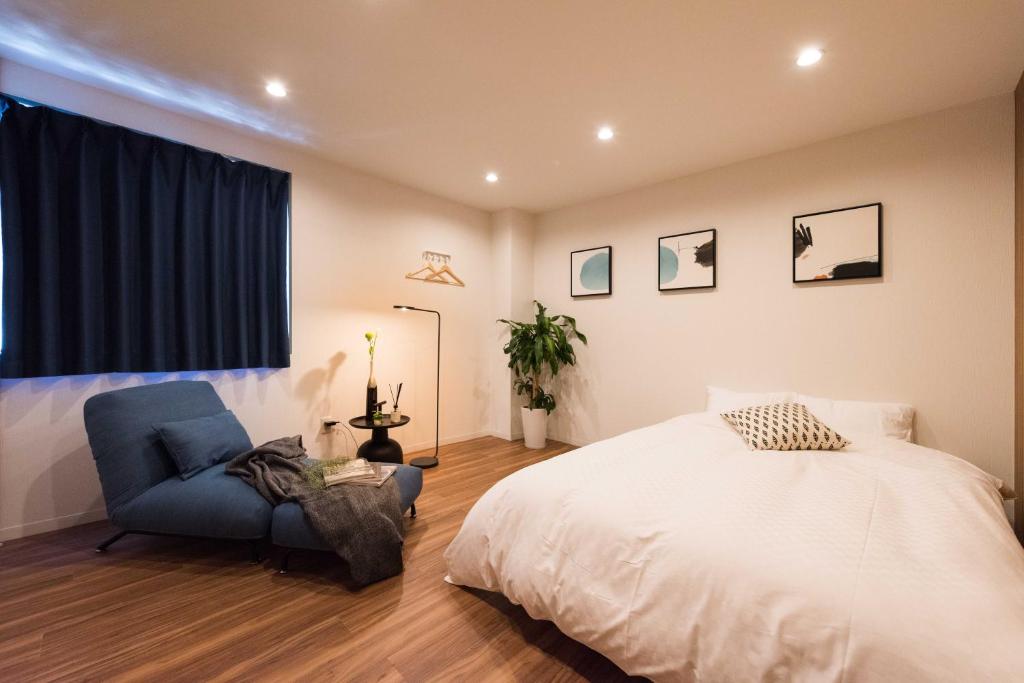 Postel nebo postele na pokoji v ubytování TORA HOTEL Tokyo Skytree 寅ホテル スカイツリーG