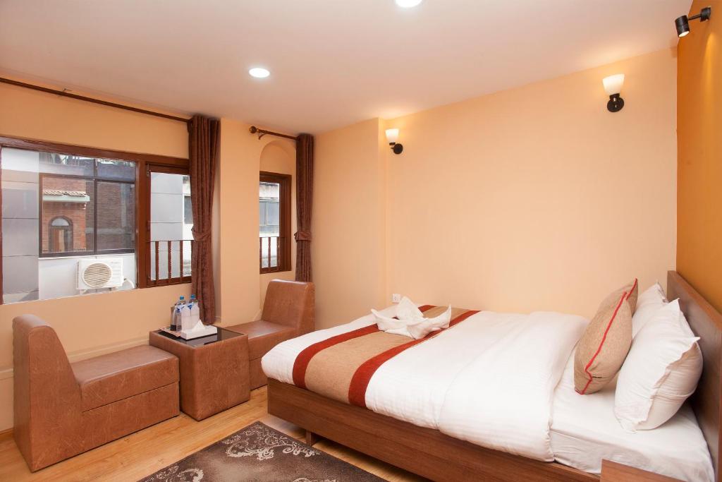 Postel nebo postele na pokoji v ubytování Holiday Hostel