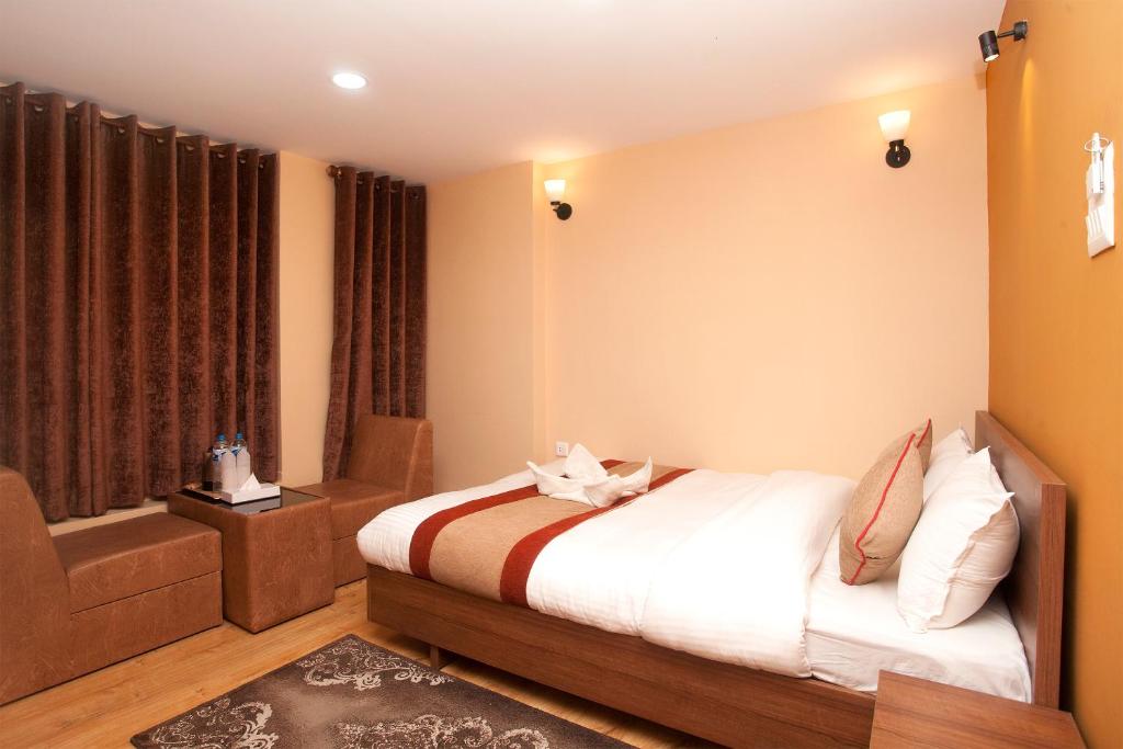 Postel nebo postele na pokoji v ubytování Holiday Hostel