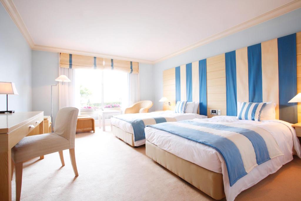 Postel nebo postele na pokoji v ubytování L'Hotel de Hiei