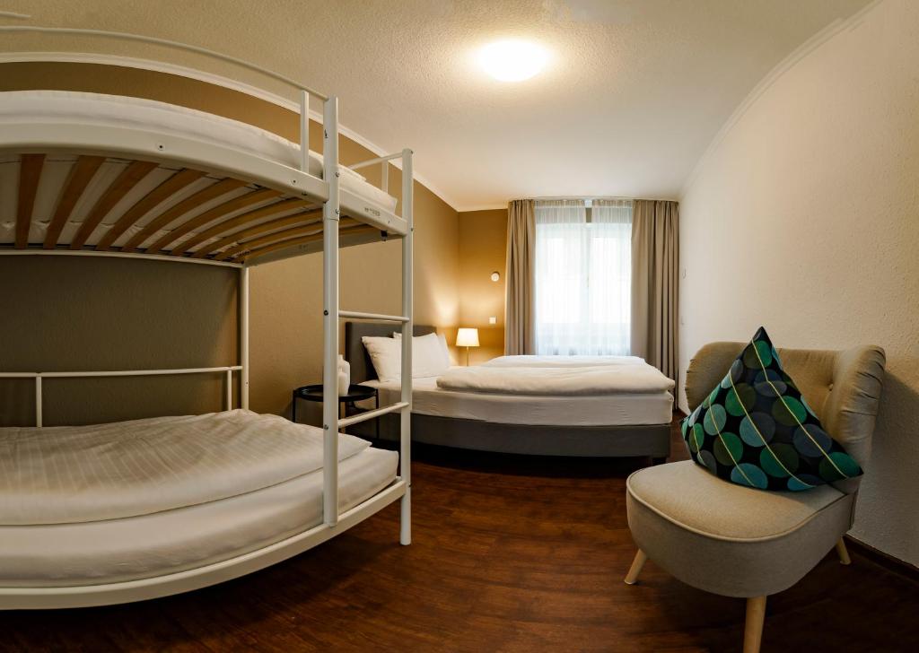 Postel nebo postele na pokoji v ubytování Hotel Rappen am Münsterplatz