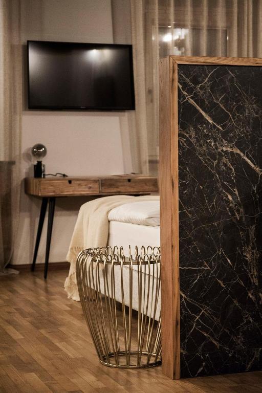 Postel nebo postele na pokoji v ubytování Hotel Pok Garni