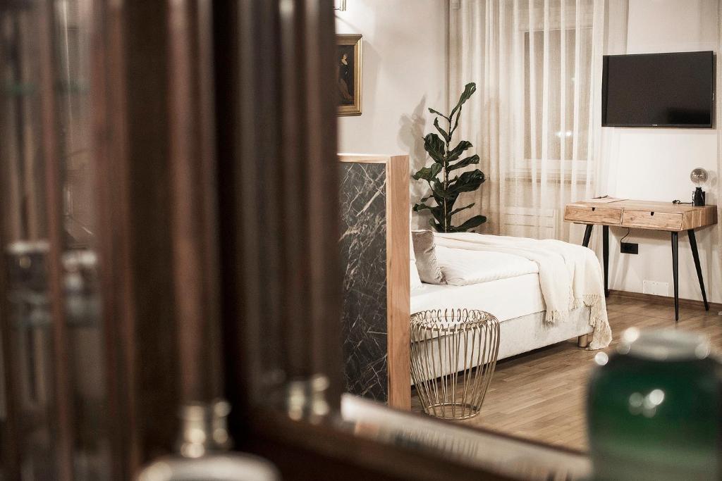 Postel nebo postele na pokoji v ubytování Hotel Pok Garni