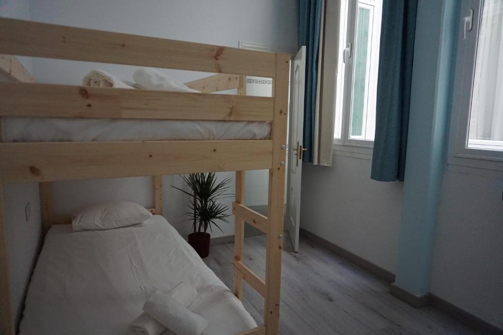 Posteľ alebo postele v izbe v ubytovaní Apartamentos Mediterránea Centro