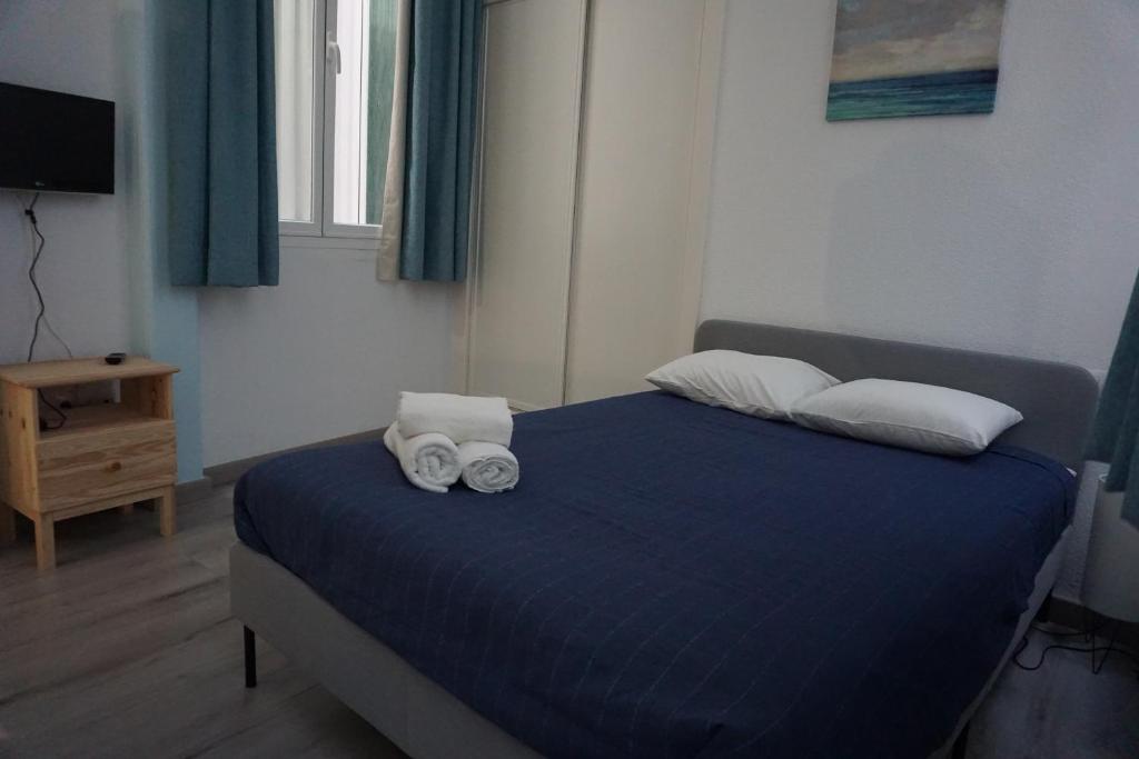 Posteľ alebo postele v izbe v ubytovaní Apartamentos Mediterránea Centro