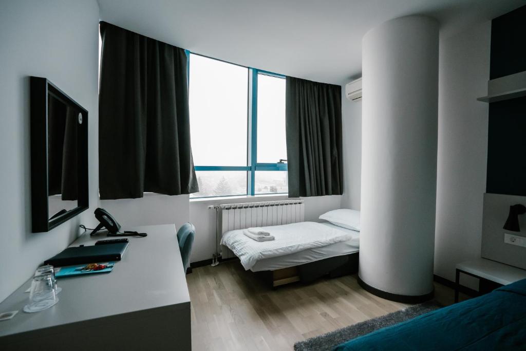 Postel nebo postele na pokoji v ubytování Hotel Blue