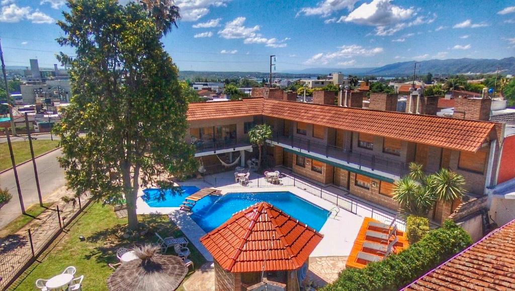 an aerial view of a house with a swimming pool at Hotel Carlos Paz in Villa Carlos Paz