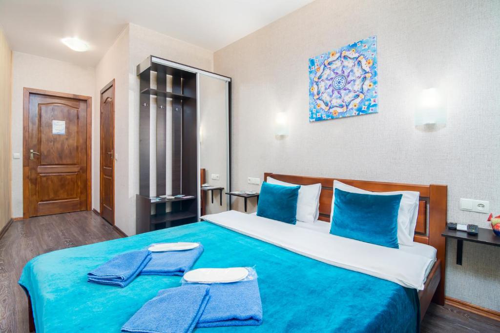 Postel nebo postele na pokoji v ubytování Mini-Hotel Ocean