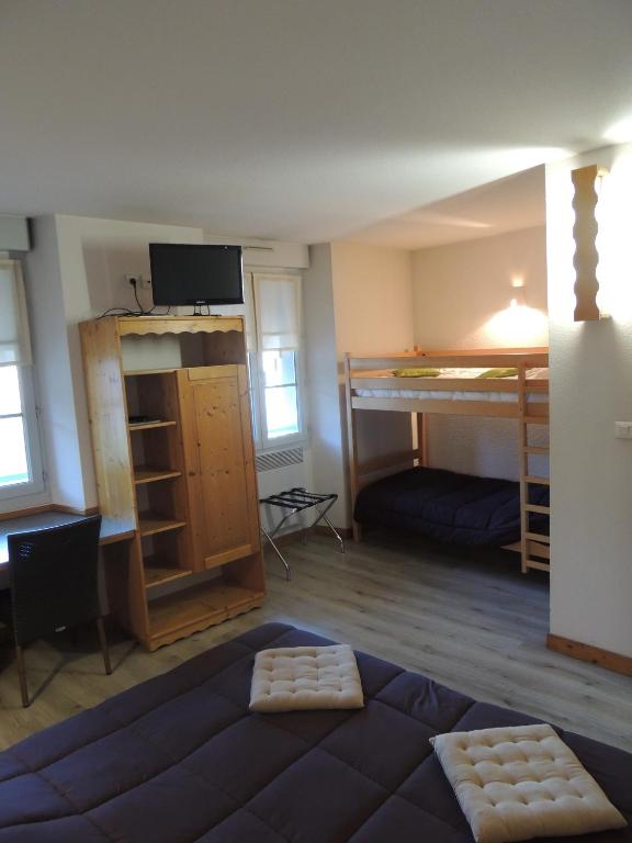 Postel nebo postele na pokoji v ubytování Hôtel de La Vallée