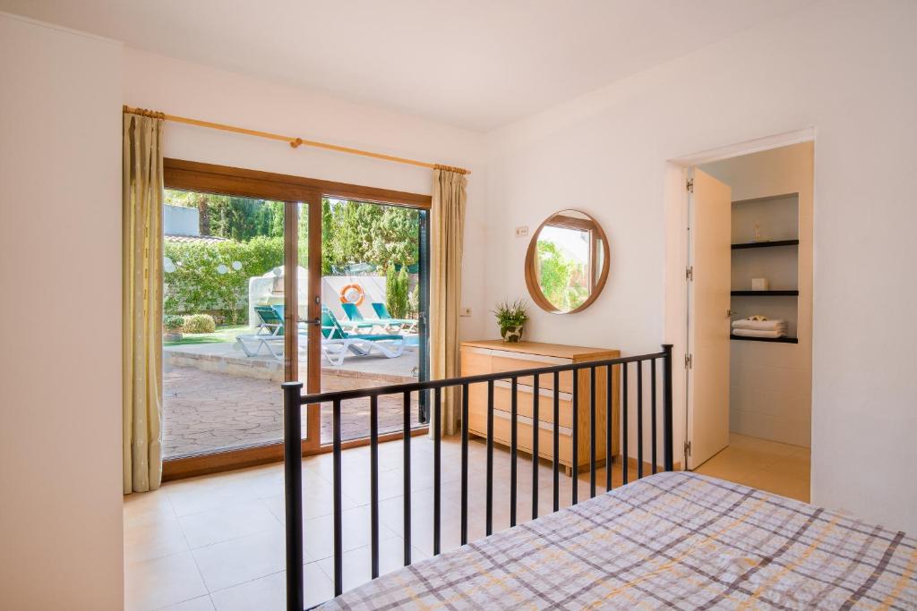 Postel nebo postele na pokoji v ubytování Villa Mumare
