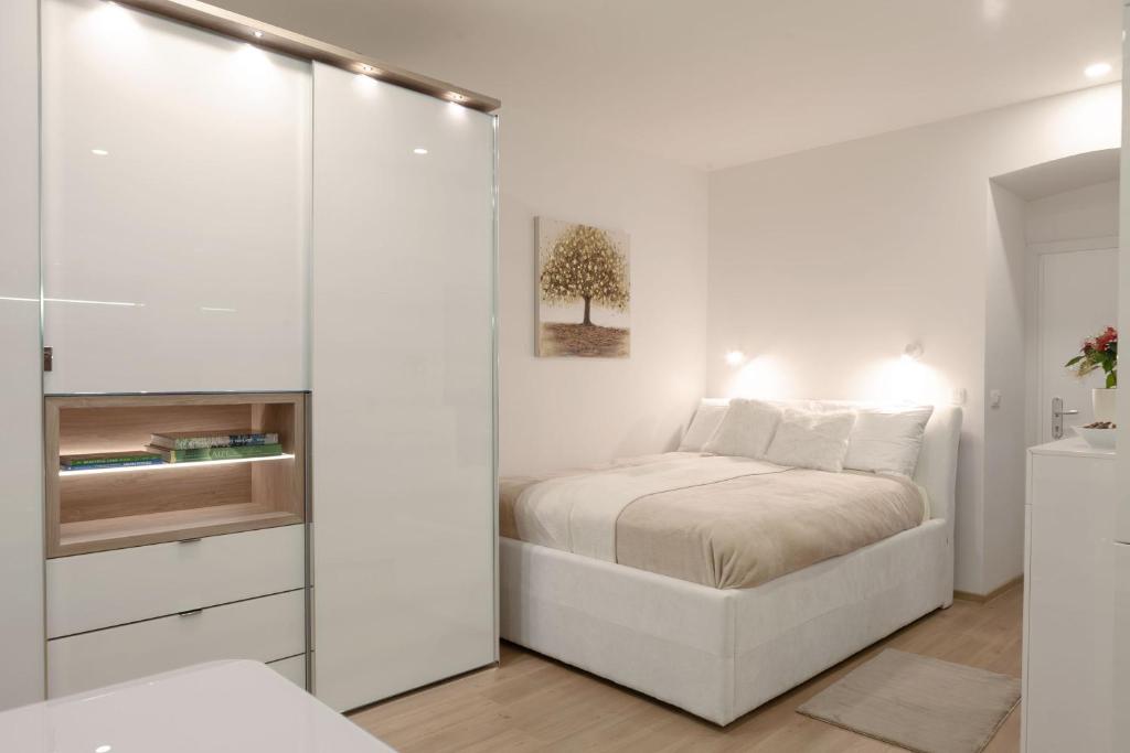 En eller flere senge i et værelse på Studio Apartment Gea Tour As Ljubljana