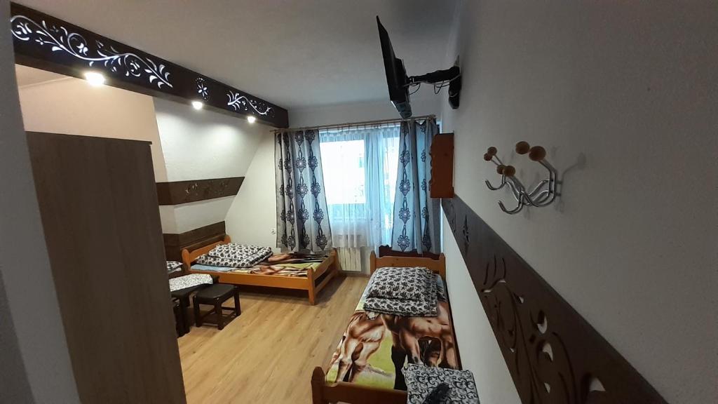 Posteľ alebo postele v izbe v ubytovaní Pokoje Gościnne U Moniki i Daniela