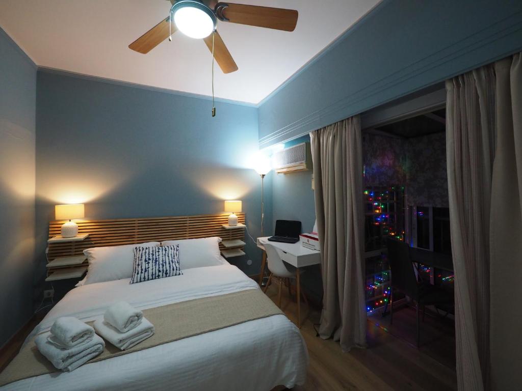 A bed or beds in a room at Sophia's Penthouse Apartment With Jacuzzi and Acropolis View From Big Terrace
