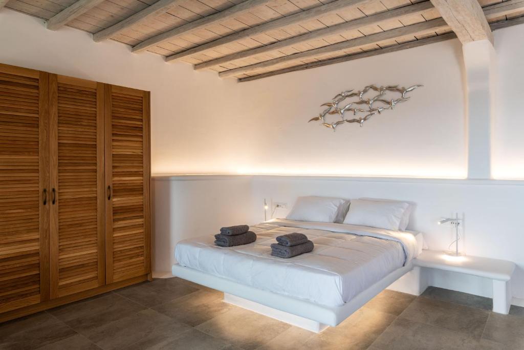 Postel nebo postele na pokoji v ubytování Mykonos Divino