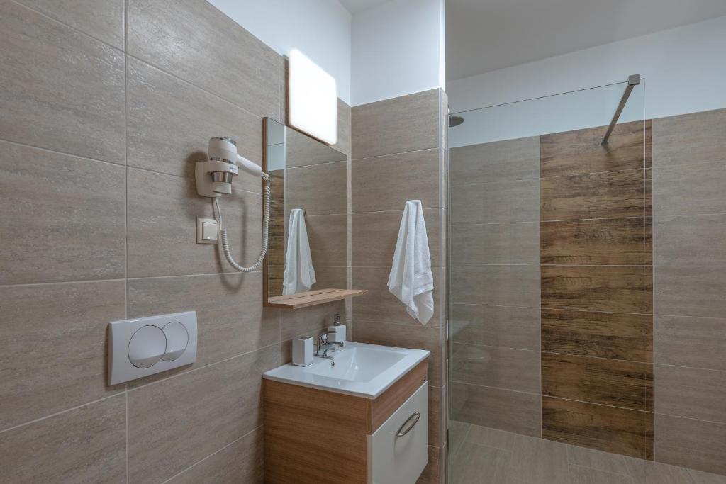 Koupelna v ubytování Hídfő Apartman-Nyugalom Szigetei
