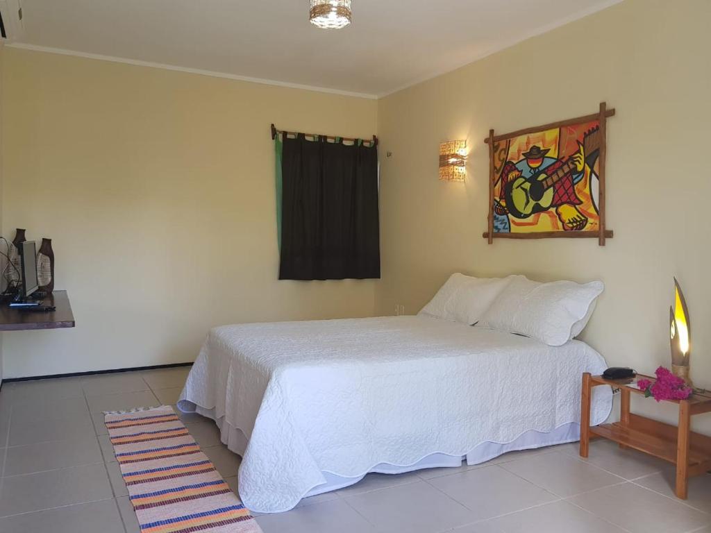 Voodi või voodid majutusasutuse Pousada Coqueiro Beach toas
