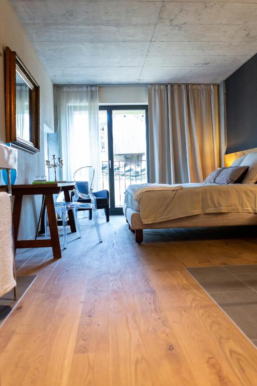 Letto o letti in una camera di Hotel de l’Ours Preles