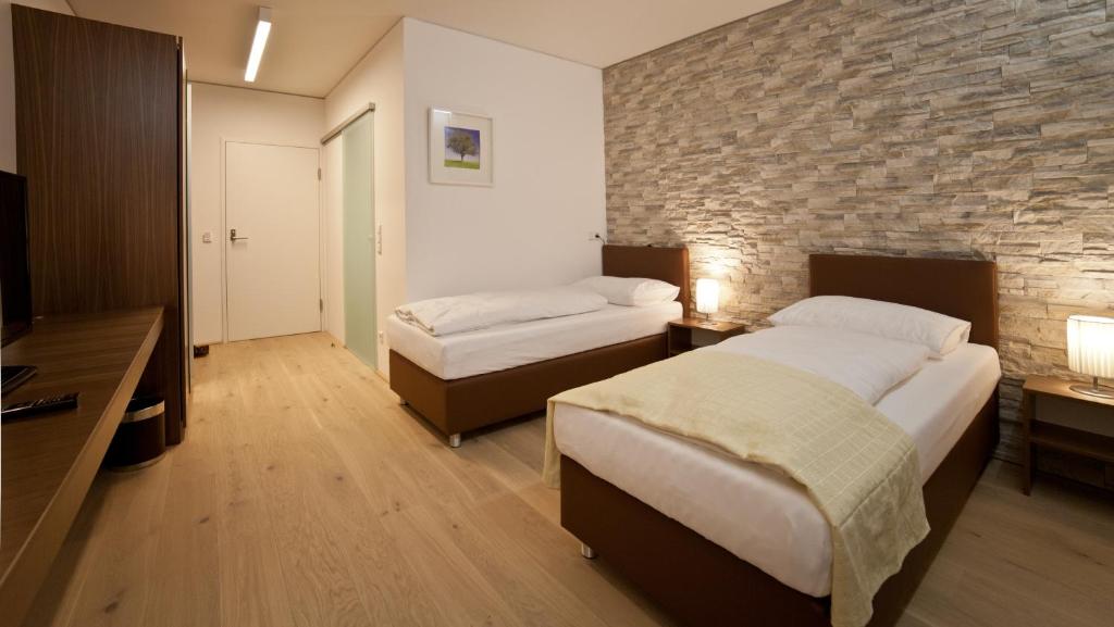 Postel nebo postele na pokoji v ubytování Hotel Wallern Garni