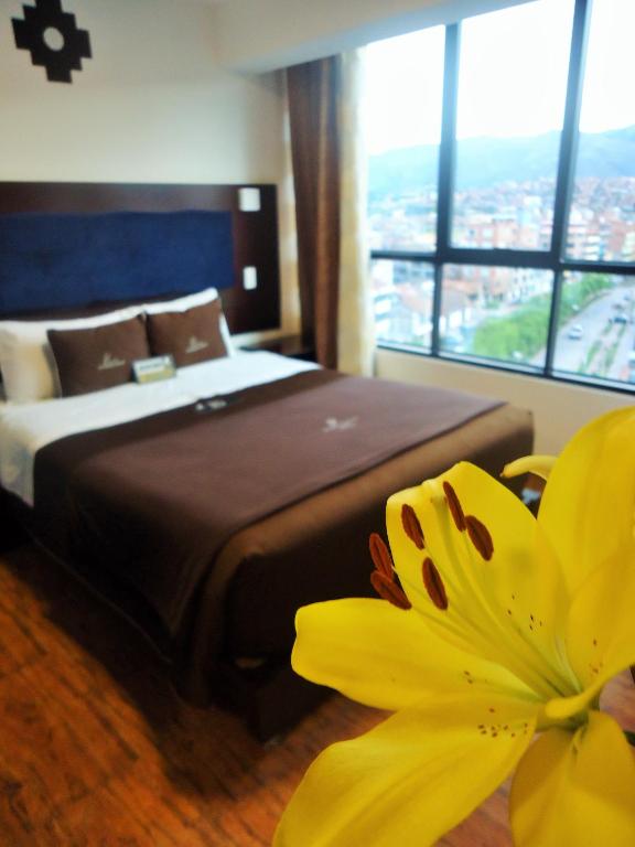 Postel nebo postele na pokoji v ubytování San Francisco Cusco Hotel