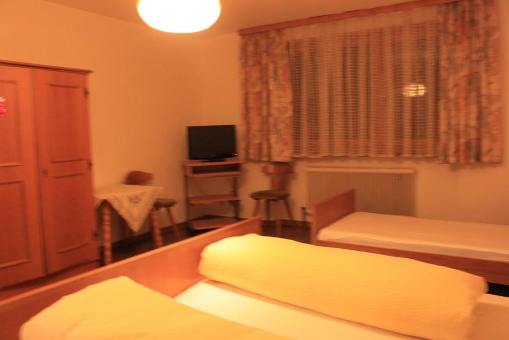 Postel nebo postele na pokoji v ubytování Pension & Restaurant TsingDao