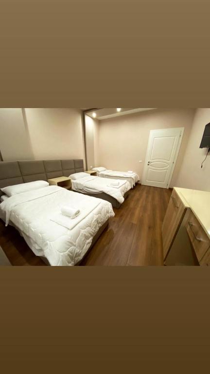 Postel nebo postele na pokoji v ubytování Hotel Holiday
