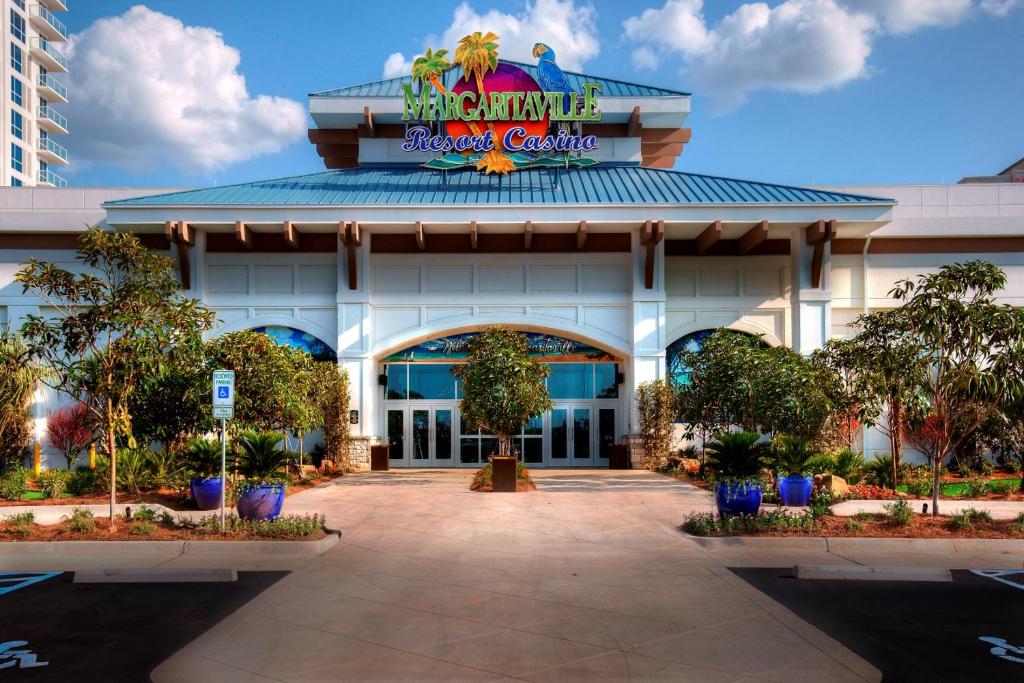 a building with a sign for the walt disney world resort at Margaritaville Resort Casino in Bossier City