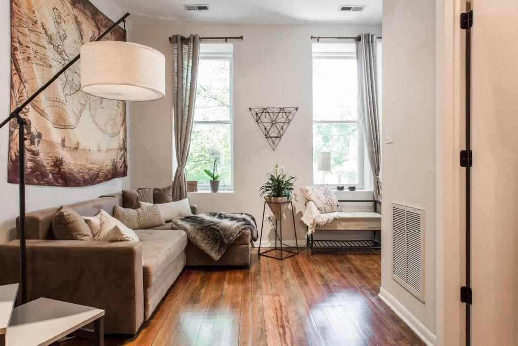 a living room with a couch and a chair at ✪ Cozy 1 Bedroom close to Downtown Chicago ✪ in Chicago