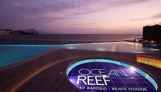 una señal que lee el arrecife oceánico al lado del océano en Departamento de playa - Condominio OCEAN REEF - SAN BARTOLO, en San Bartolo