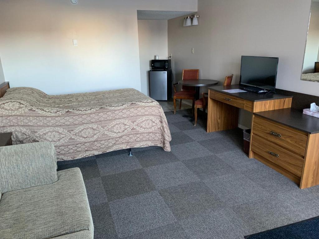 TV a/nebo společenská místnost v ubytování Airways Motel