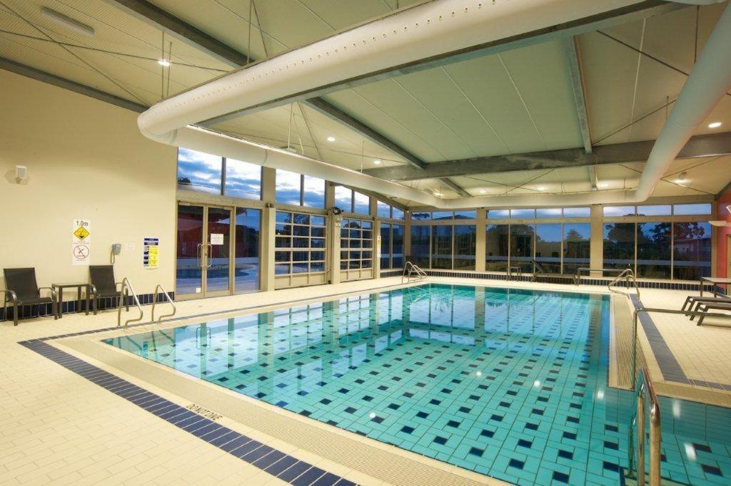 a large swimming pool in a building at Broadbeach Inverloch in Inverloch