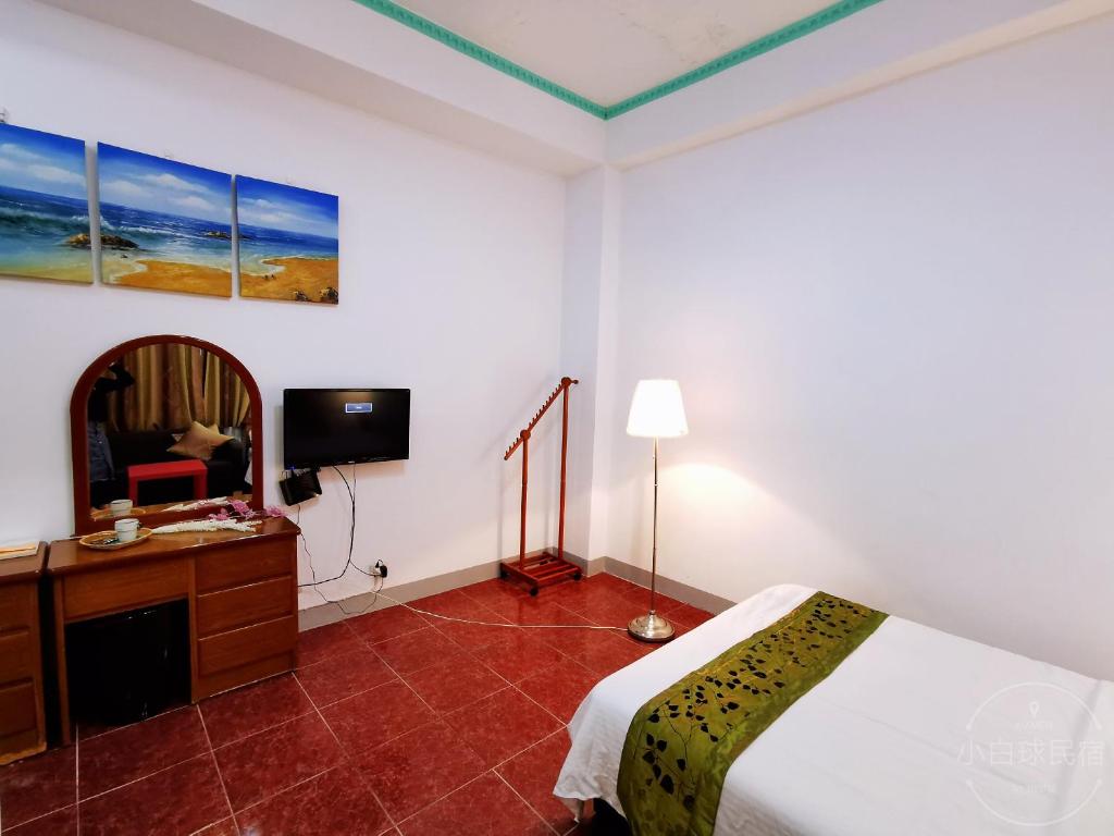 Postel nebo postele na pokoji v ubytování Yilan Golf B&B