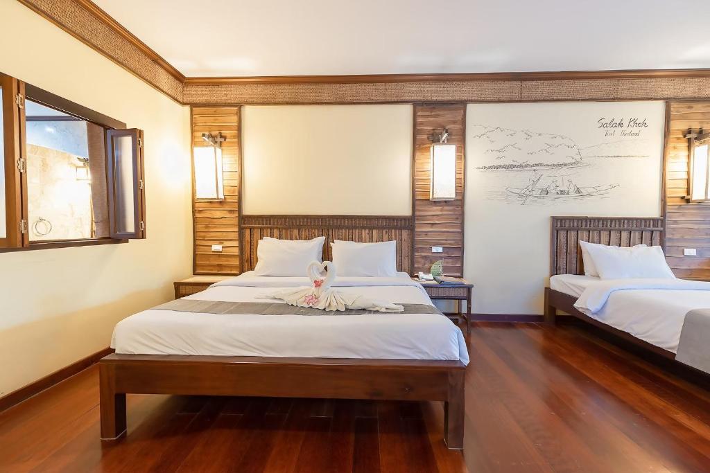 Postel nebo postele na pokoji v ubytování Banpu Resort Trat