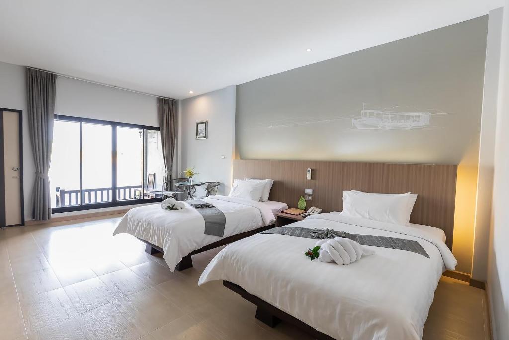 Postel nebo postele na pokoji v ubytování Banpu Resort Trat