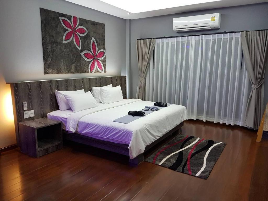 Postel nebo postele na pokoji v ubytování Banpu Resort Trat