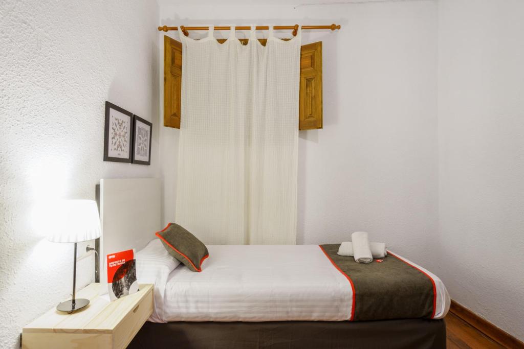 Cama o camas de una habitación en Hostal Austria