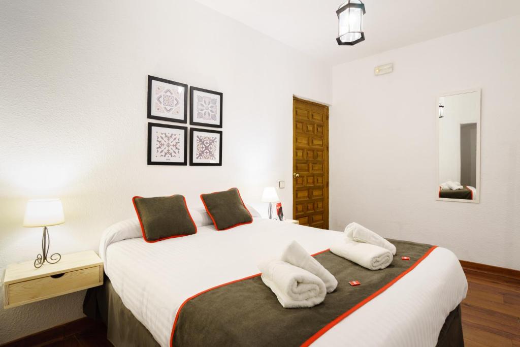 Cama o camas de una habitación en Hostal Austria