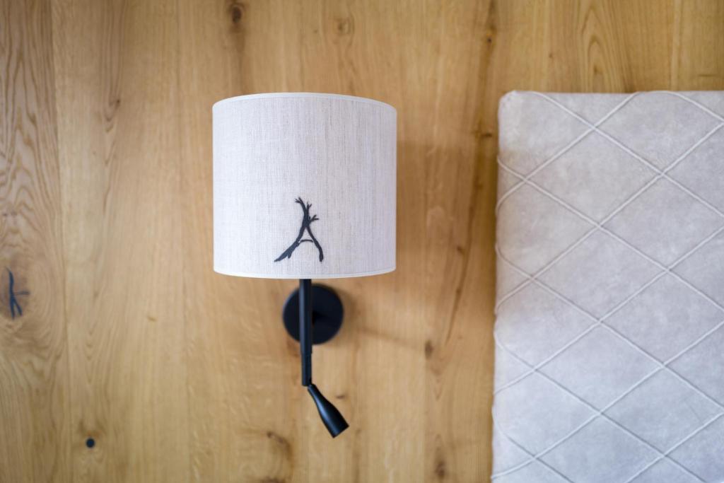 Postel nebo postele na pokoji v ubytování Boutiquehotel die Alpbacherin 4 Sterne Superior