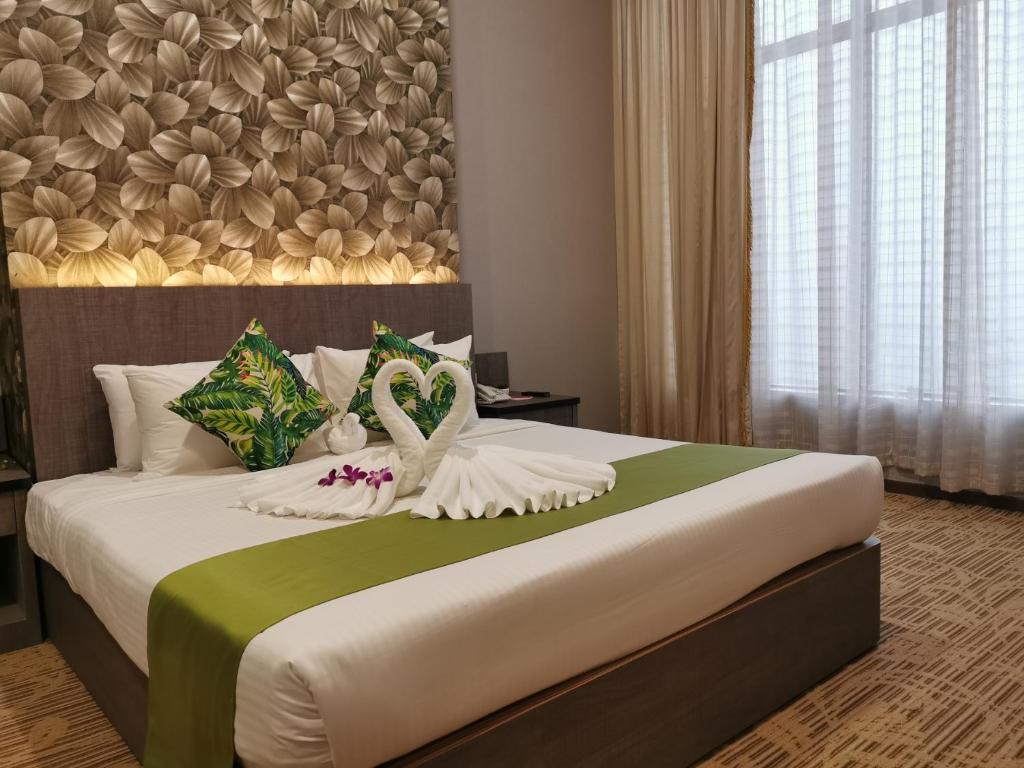 Postel nebo postele na pokoji v ubytování New York Hotel