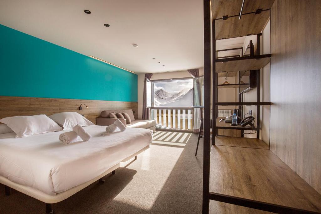 Postel nebo postele na pokoji v ubytování Pic Maià Mountain Hotel