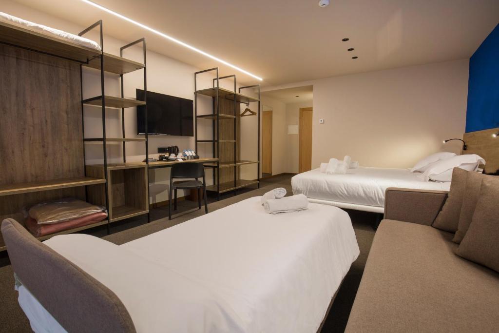 Postel nebo postele na pokoji v ubytování Pic Maià Mountain Hotel