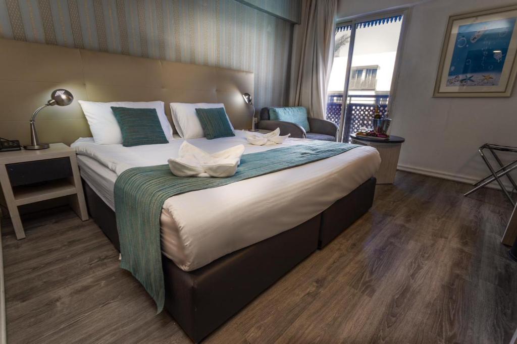 Postel nebo postele na pokoji v ubytování G hotel