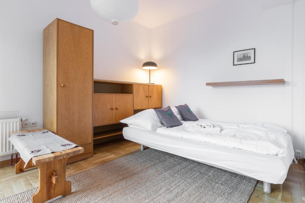 Posteľ alebo postele v izbe v ubytovaní Apartamenty Orkana Centrum Zakopane