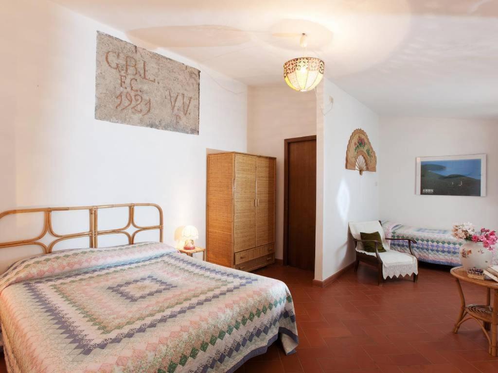Postel nebo postele na pokoji v ubytování Borgo De Salaioli