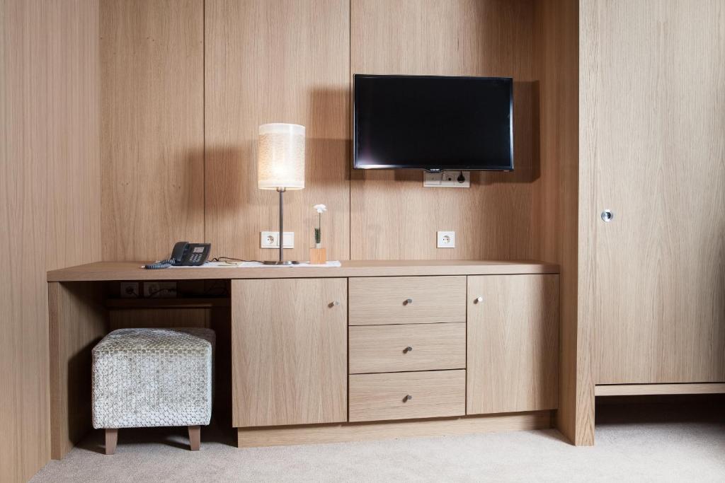 TV a/nebo společenská místnost v ubytování Hotel Trofana Alpin