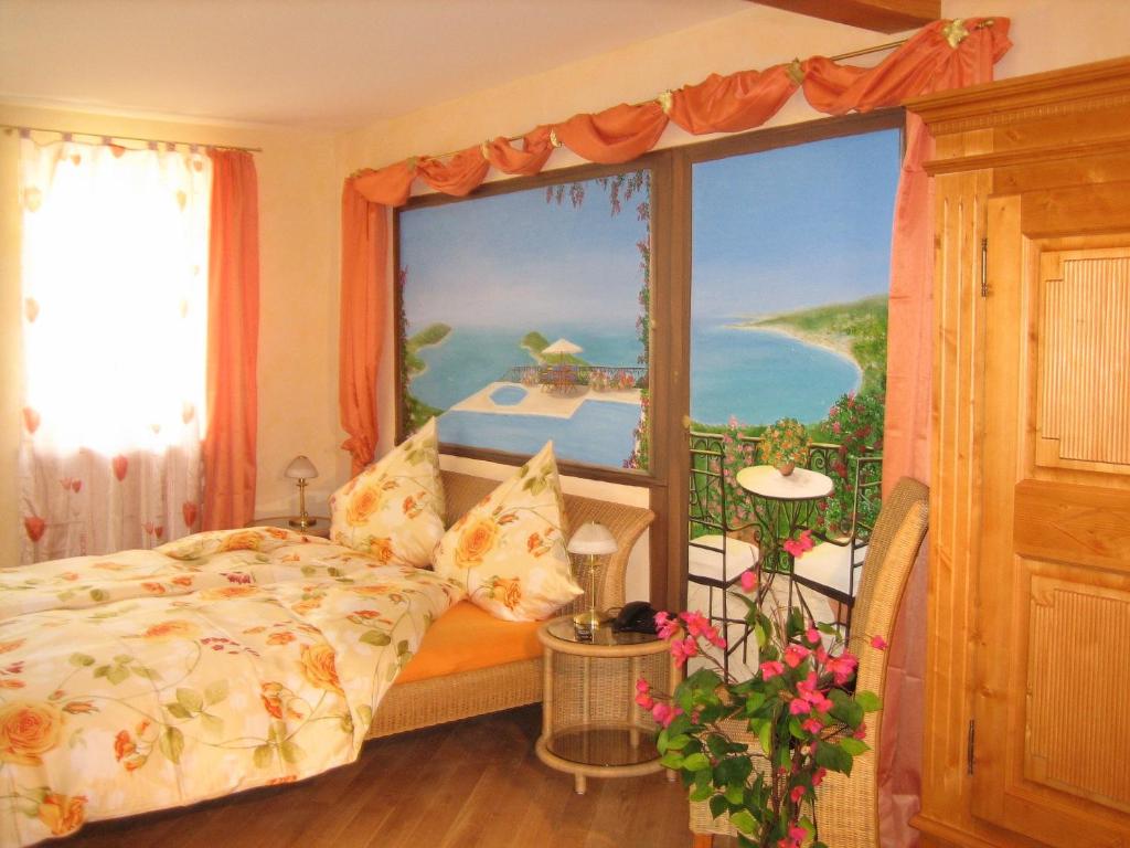 Postel nebo postele na pokoji v ubytování Cleo´s Hotel Kallstadt